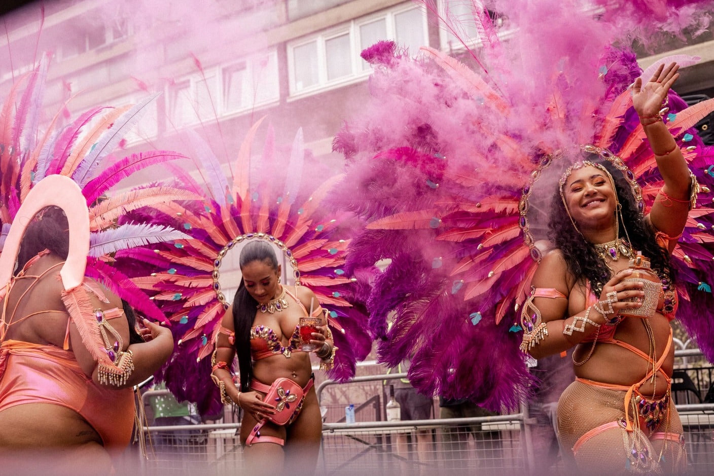 Three women celebrating Notting Hill Carnival.